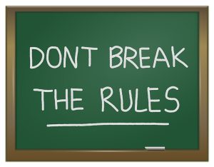 Illustration depicting a green chalk board with the words 'dont break the rules' written on it in white chalk.