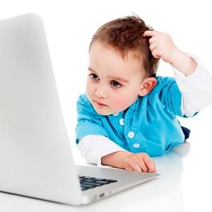 Confused boy with a laptop computer - isolated over a white background