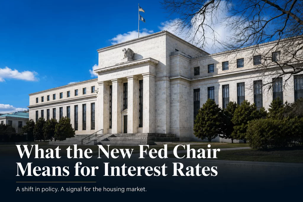 Exterior of the Federal Reserve building on a bright day with the article title 'What the New Fed Chair Means for Interest Rates' shown in large text.